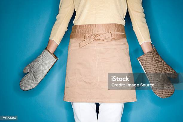 Woman Wearing Oven Gloves Stock Photo - Download Image Now - Cut Out, Oven Mitt, Adult