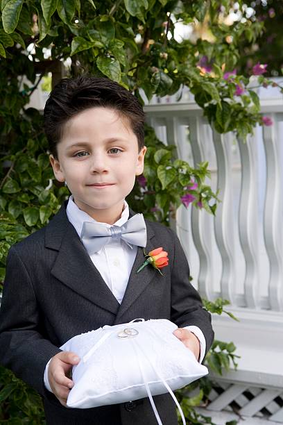 Page boy holding wedding rings  ring bearer stock pictures, royalty-free photos & images
