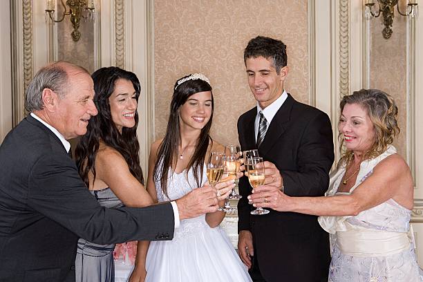 Quinceanera girl toasting with family  quinceanera stock pictures, royalty-free photos & images