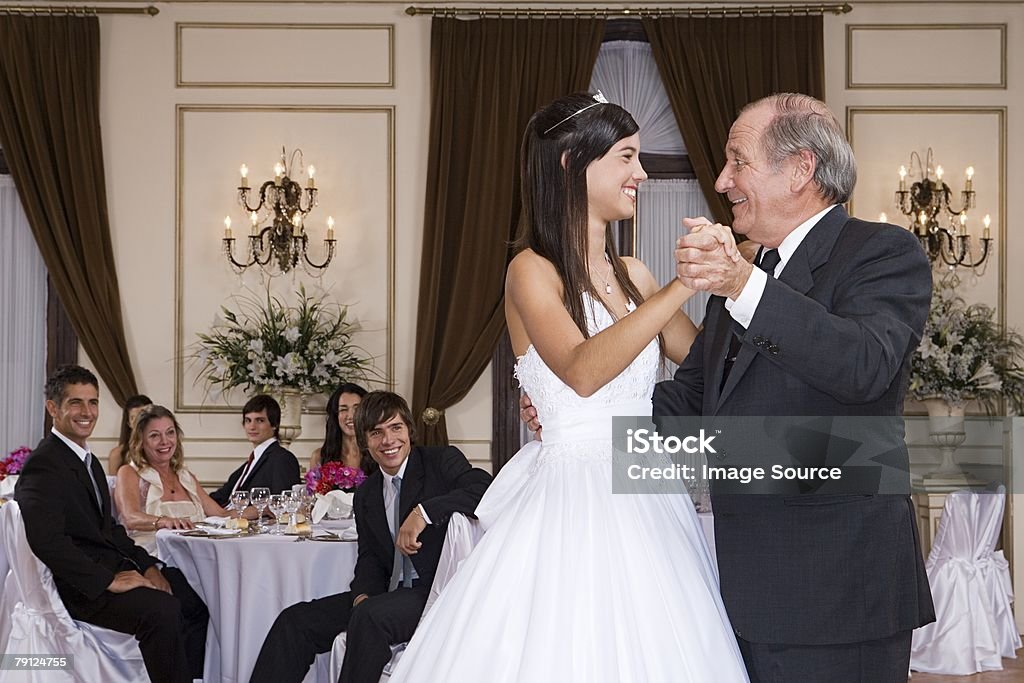 Girl and grandfather dancing at quinceanera  Quinceanera Stock Photo