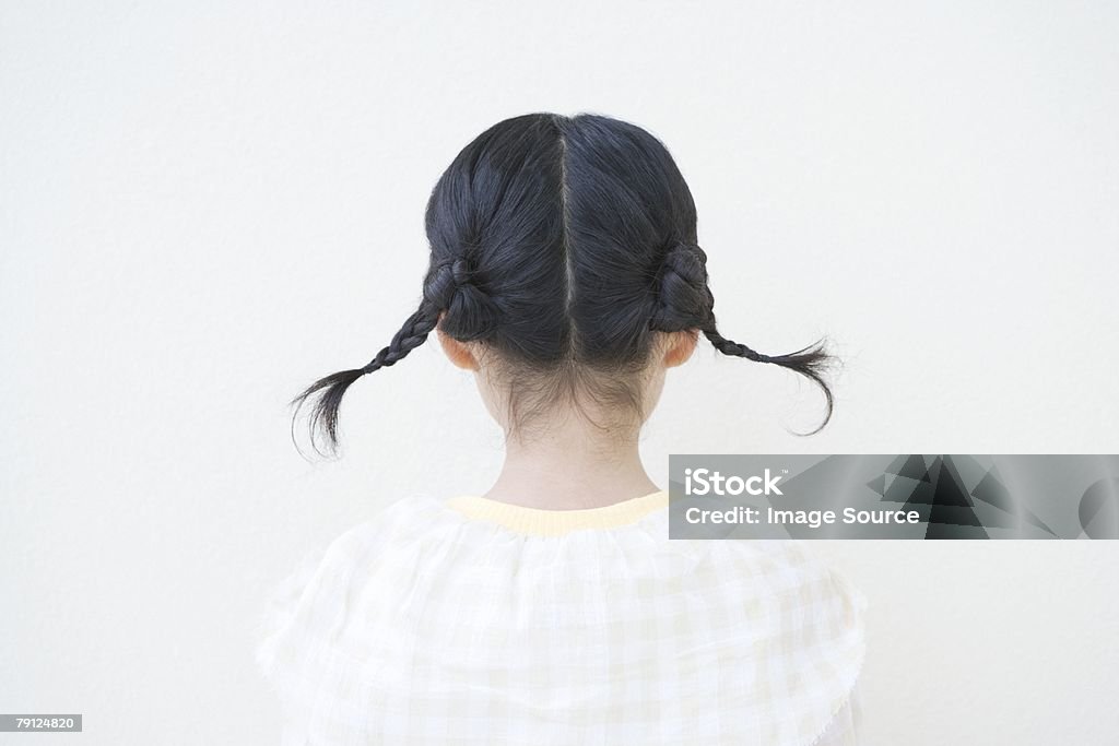 Girl with pigtails  Rear View Stock Photo