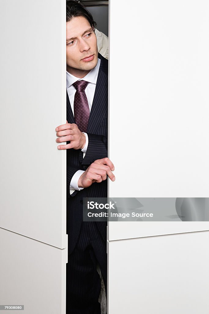 Businessman in cupboard  Men Stock Photo