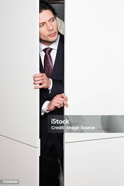 Businessman In Cupboard Stock Photo - Download Image Now - Men, Cabinet, Hiding