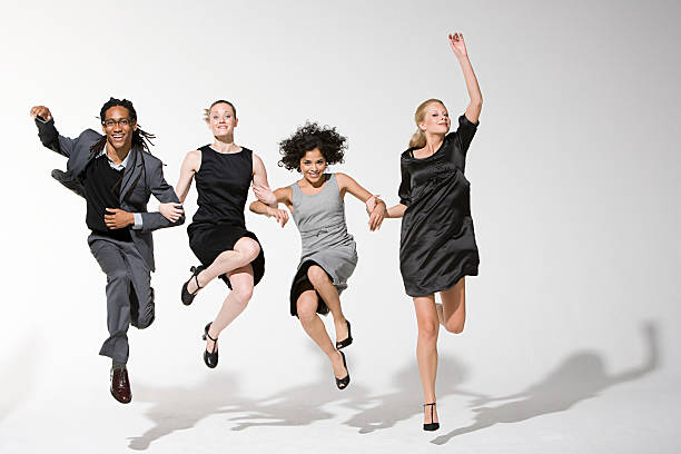 会社員ジャンプ - jumping business women dancing ストックフォトと画像