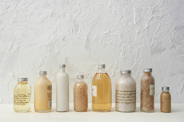 Row of cosmetics bottles  bath salt stock pictures, royalty-free photos & images