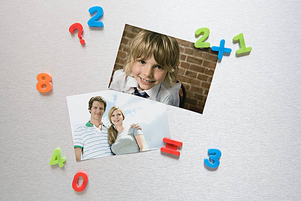Photos on a fridge   magnet photos stock pictures, royalty-free photos & images