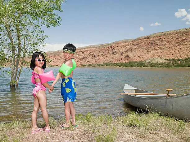 Photo of Girl and boy by lake