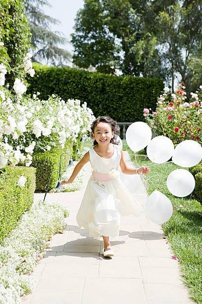 Flower girl with balloons  flower girl stock pictures, royalty-free photos & images