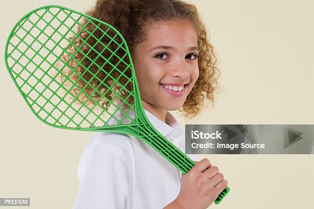 Menina Com Raquete De Ténis - Fotografias de stock e mais imagens de Aluno da Escola Primária - Aluno da Escola Primária, Articulação humana, Bege