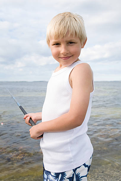 un garçon de pêche - sweden fishing child little boys photos et images de collection