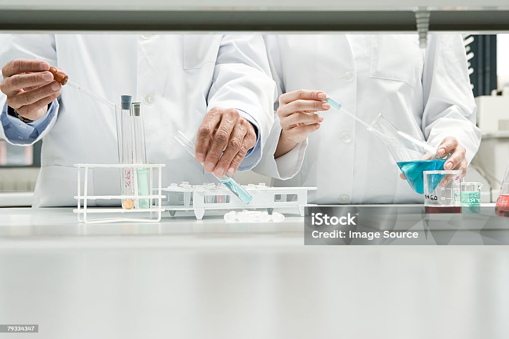 Scientists conducting an experiment  Laboratory Stock Photo