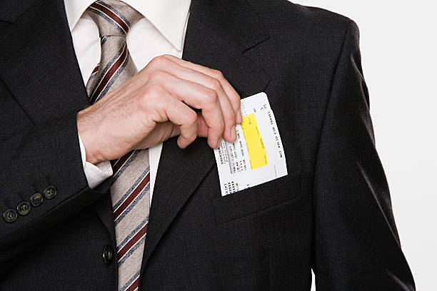 businessman putting tickets in his pocket - pocket suit close up shirt стоковые фото и изображения