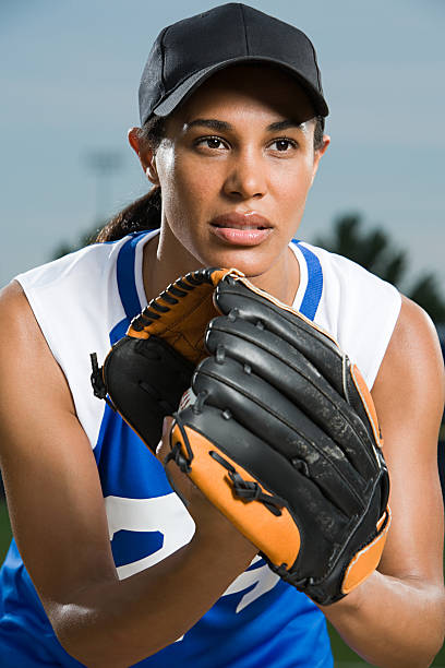 Baseball player  woman wearing baseball cap stock pictures, royalty-free photos & images