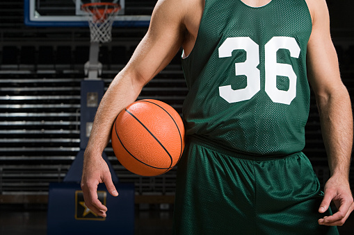 Set of dynamic portraits of young professional basketball player in motion, training isolated over white studio background. Concept of sport, achievements, competition, hobby, active lifestyle.