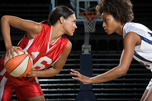 Female Basketball player concentrates in the locker room and thinks about the game. Team sport and healthy lifestyle concept.