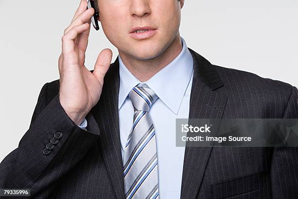 Businessman Using Hands Free Device Stock Photo - Download Image Now - 30-34 Years, 30-39 Years, 35-39 Years