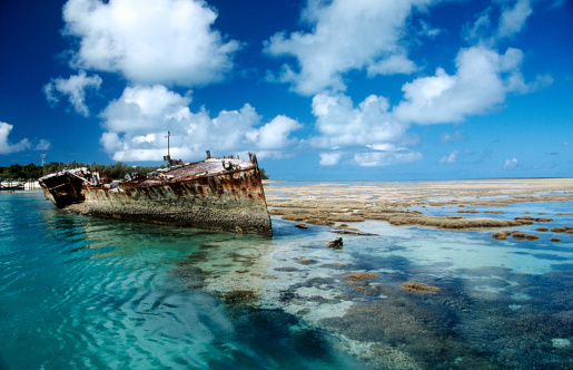 Ecological catastrophe. Oil pollution of the sea. Shipwreck close to the coastline.