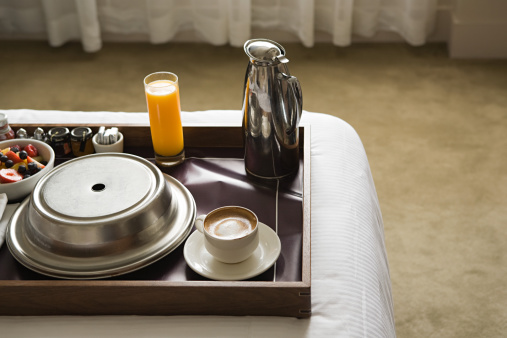 breakfast, a tray with breakfast on the bed.