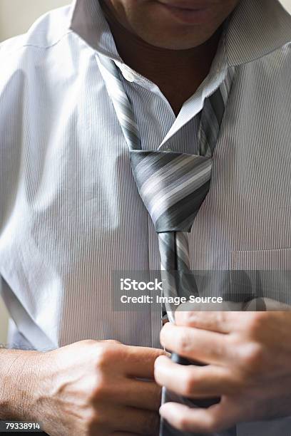 Man Tying Tie Stock Photo - Download Image Now - Adult, Adults Only, Business