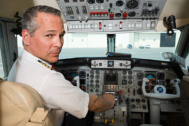 Pilot in cockpit  cockpit stock pictures, royalty-free photos & images