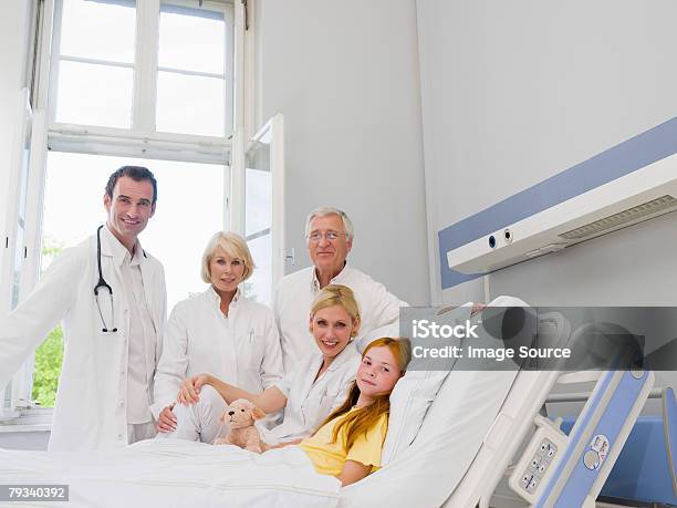 Doctors With A Patient Stock Photo - Download Image Now - Bed - Furniture, Doctor, Hospital