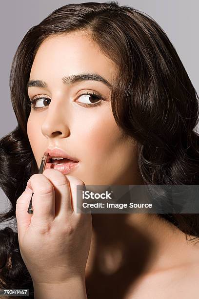 A Make Up Artist Applying Lipstick To A Model Stock Photo - Download Image Now - Lipstick, Adult, Adults Only