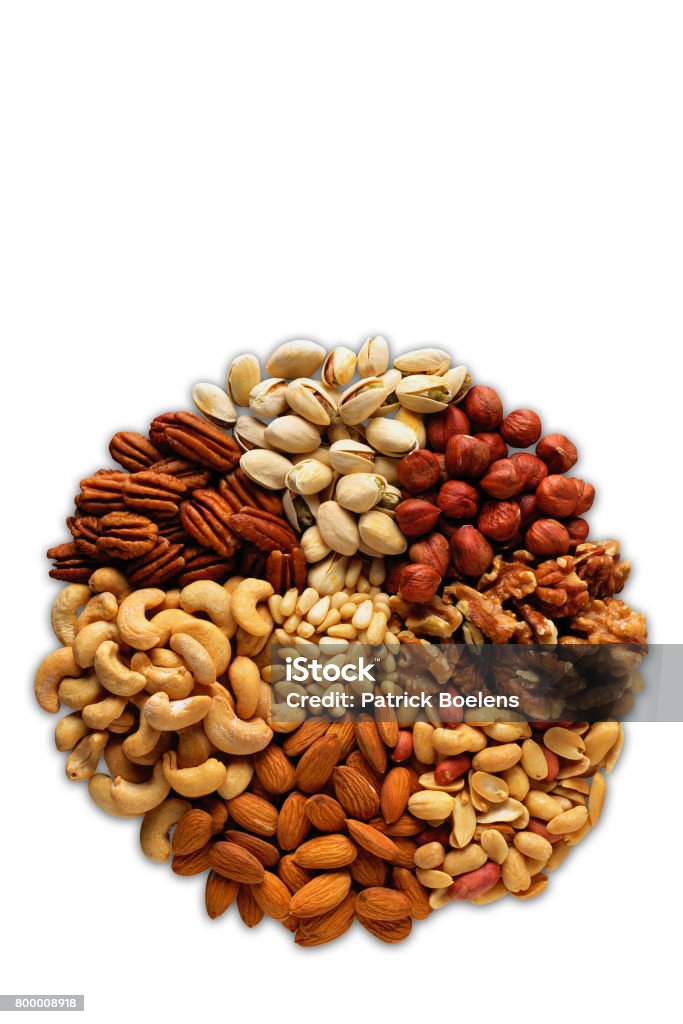 Assorted nuts in the form of a circle (peanuts, almonds, hazelnuts, pine nuts, cashews, walnuts, pistachio) on a white background Almond Stock Photo