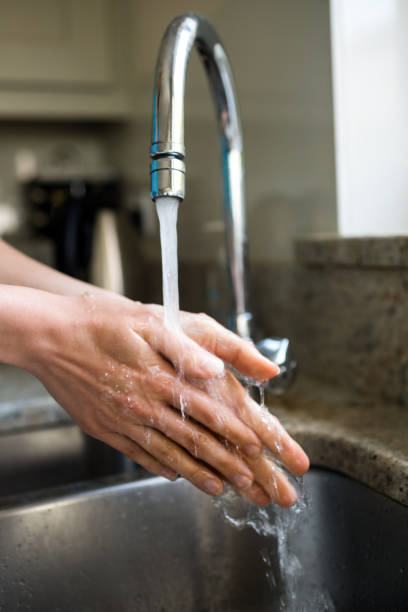 istock Pretty woman washing her hands 800011966