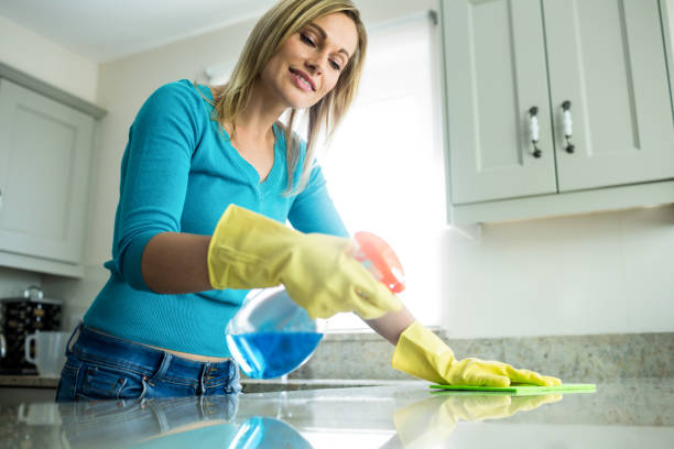 istock Pretty woman doing her house chores 800024308