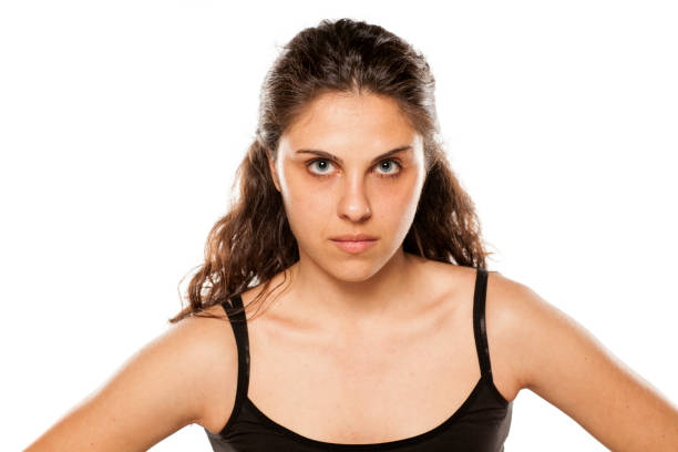 istock Suspicious young woman without makeup on white background 800178286