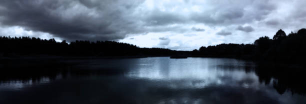 istock Night on the lake. Panoramic image of a night landscape. 800211320