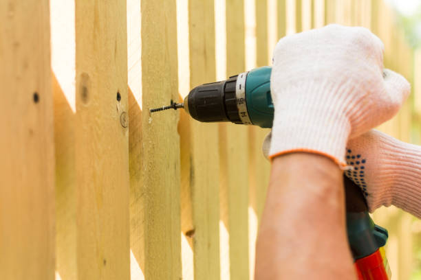 istock Hands of the carpenter holding electric screwdriver 800246552