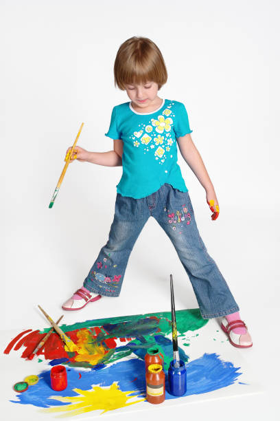 istock Little cute girl learns painting, on white background. 800289994
