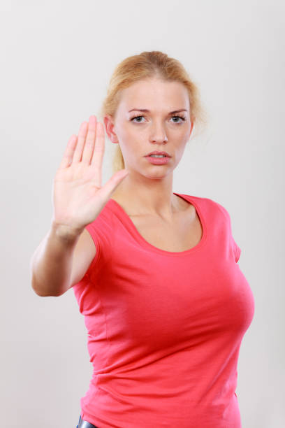 istock Woman showing stop gesture with open hand 800290110