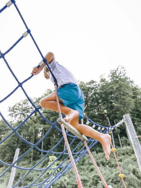 istock Child, boy playing at a children‘s playground 800293092