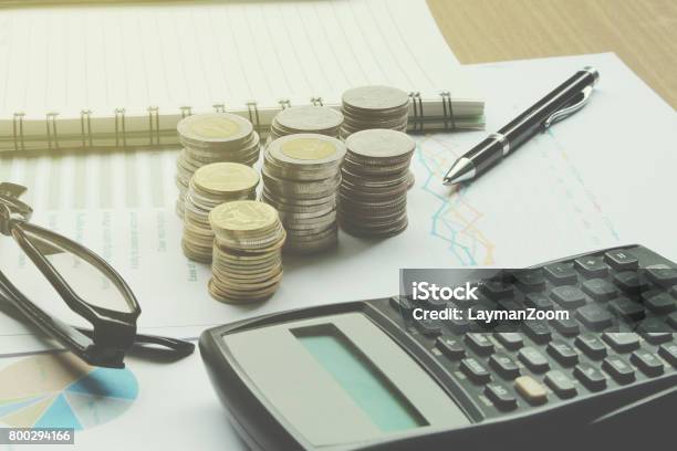 Calculator And Coins Of Thailand On The Office Desk Investment And Property For Concept Stock Photo - Download Image Now