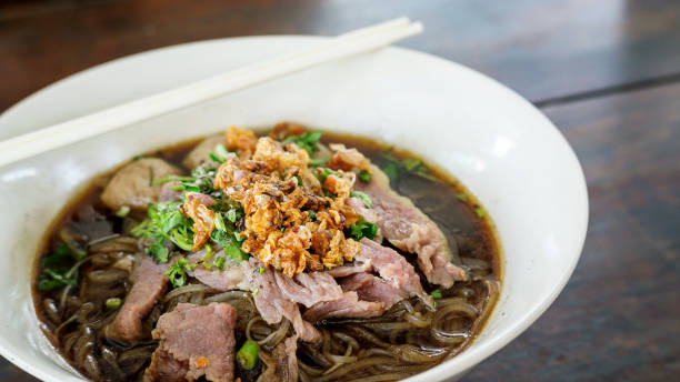 istock Noodles with pork on a wooden background (Thai noodles). 800297256