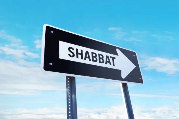 traffic sign"Shabbat" traffic sign in front of clear sky