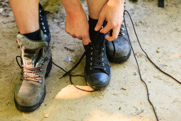 istock Hiker preparing their footwear. 800300236