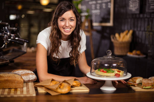 istock Pretty waitress behind the counter 800302754