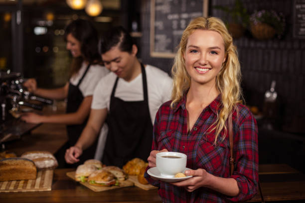 istock Smiling blonde customer in front of the counter 800303354