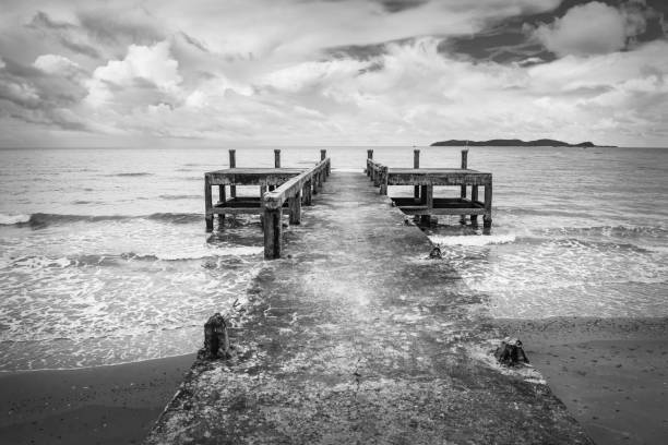 istock Black and white image of the old jetty, in a scary atmosphere. 800305832
