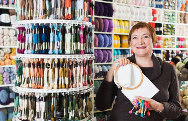 istock Woman buying embroidery accessories 800309426