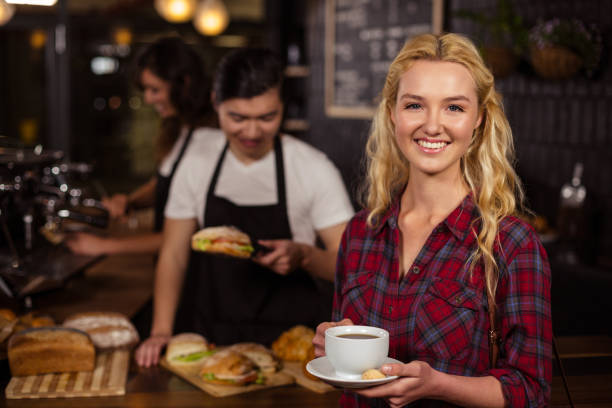 istock Smiling blonde customer in front of the counter 800313692