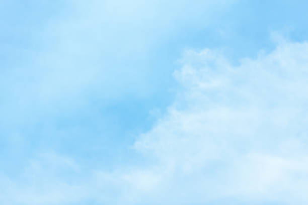 istock Blue sky background with tiny clouds. White fluffy clouds in the blue sky 800316656