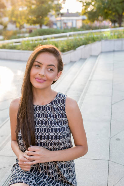 istock Young woman thinking about something and smiling. 800319574