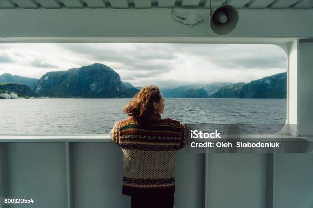 Woman Looking At Scenic View From Ferry Stock Photo - Download Image Now - Norway, Ferry, Nature