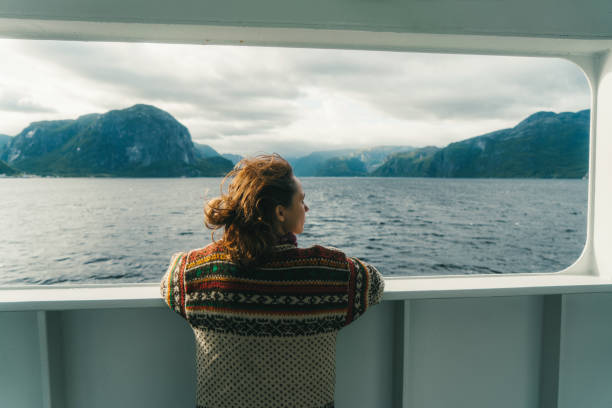 istock Woman looking at scenic view from ferry 800320556