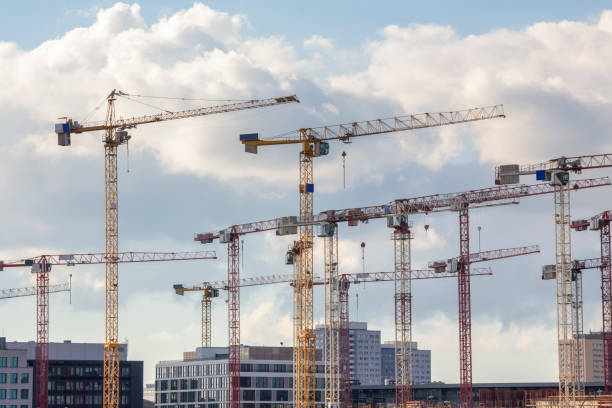istock some construction cranes in berlin city 800334028