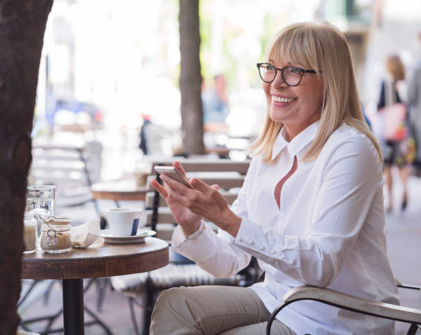 istock Mature woman working at cafe 800341800